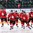 ZUG, SWITZERLAND - APRIL 20: Switzerland's Robin Fuchs #21 and teammates skate to the bench after a third period goal against Latvia during preliminary round action at the 2015 IIHF Ice Hockey U18 World Championship. (Photo by Francois Laplante/HHOF-IIHF Images)